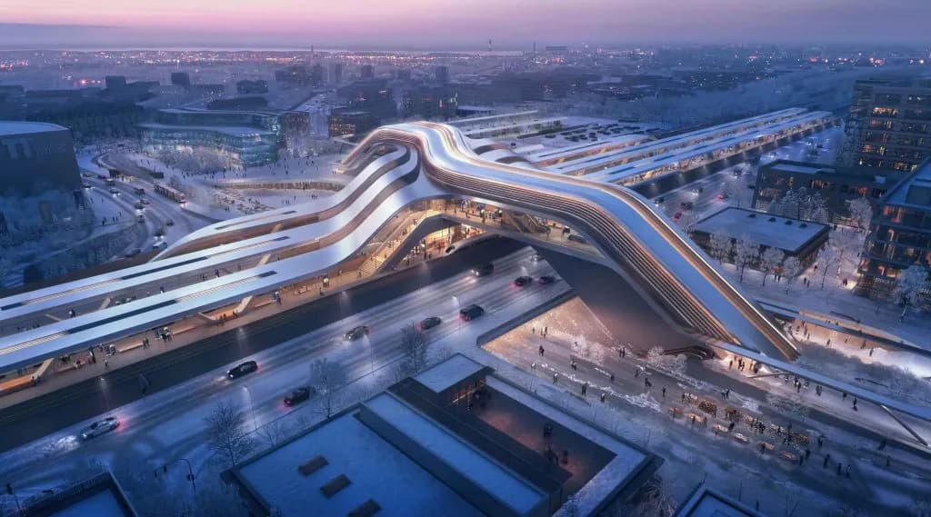 A flowing elevated station structure winding through a snow-covered city at dusk.